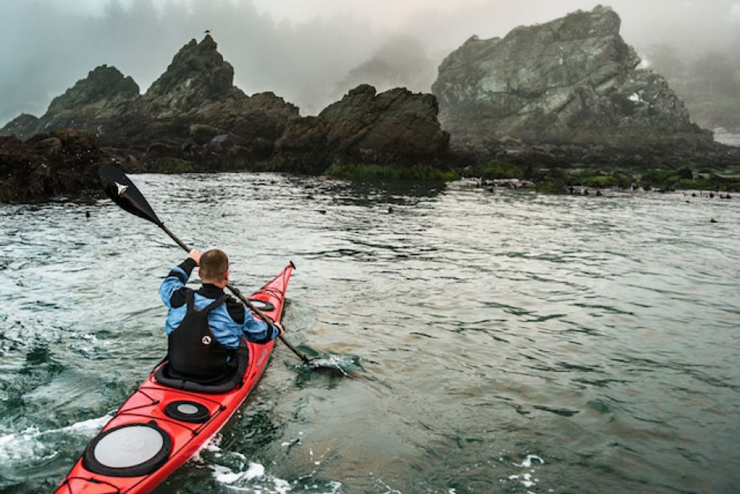 man paddling a Wilderness Systems Tempest 170 composite sea kayak
