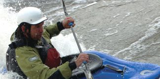 Man whitewater kayaking in a Liquidlogic Big Wheel kayak