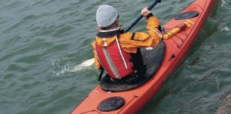 Paddler in a Capella 166 RM sea kayak by P&H