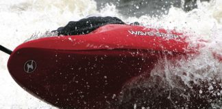 The WaveSport ZG kayak surfing through whitewater