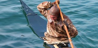 Man demonstrates modern Greenland kayaking