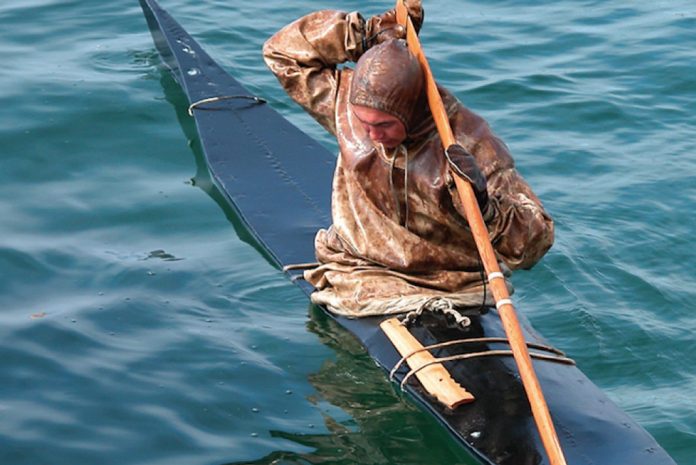 Man demonstrates modern Greenland kayaking