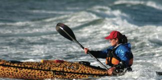 Justine Curgenven paddles her customized leopard-print kayak