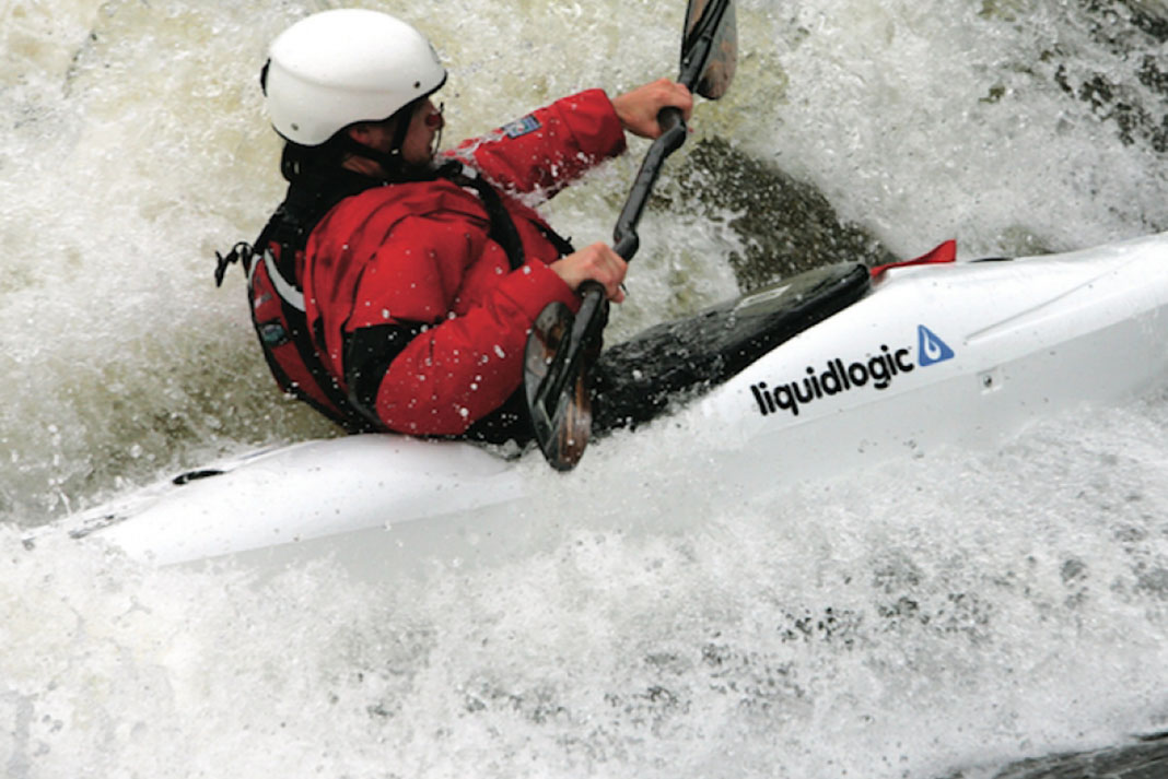 Person paddling a Liquidlogic Remix kayak through whitewater