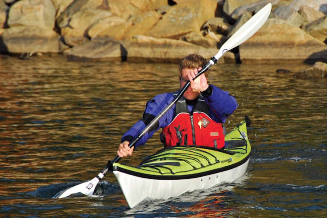 Person paddling a Zephyr 160 Pro kayak from Wilderness Systems
