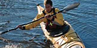 Man paddling in the Easky 15 sea kayak from Venture Kayaks