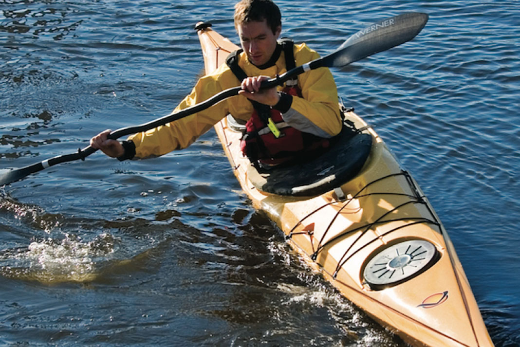 Man paddling in the Easky 15 sea kayak from Venture Kayaks