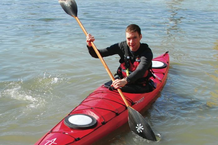man paddling a Dagger Alchemy 14.0 S sea kayak