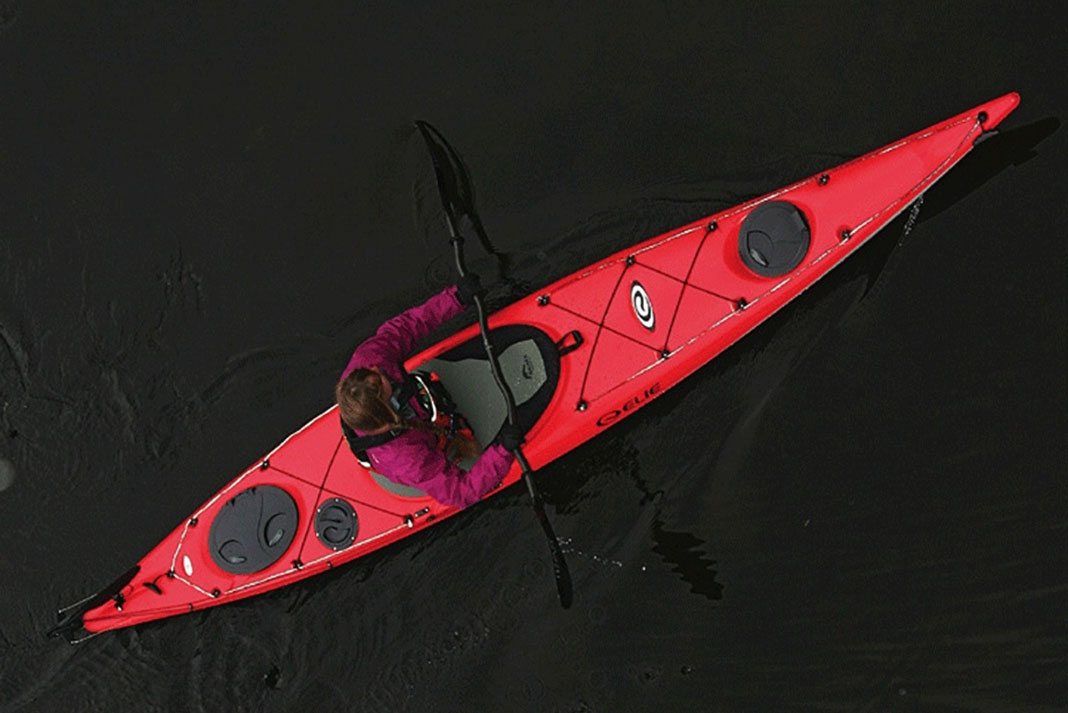 Overhead view of a man paddling the Elie Strait 140 XE light touring kayak
