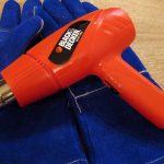 Kayak Repair: How To Fix a Cracked Kayak Orange heat gun laying on blue work gloves