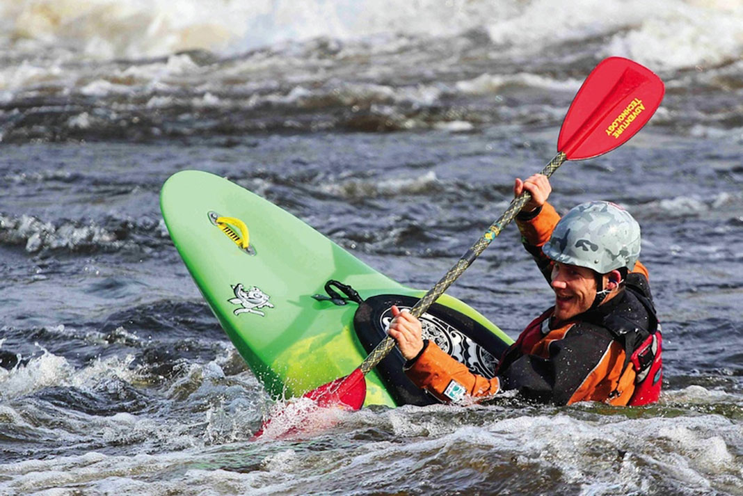 Man paddles in a Pyranha Loki kayak