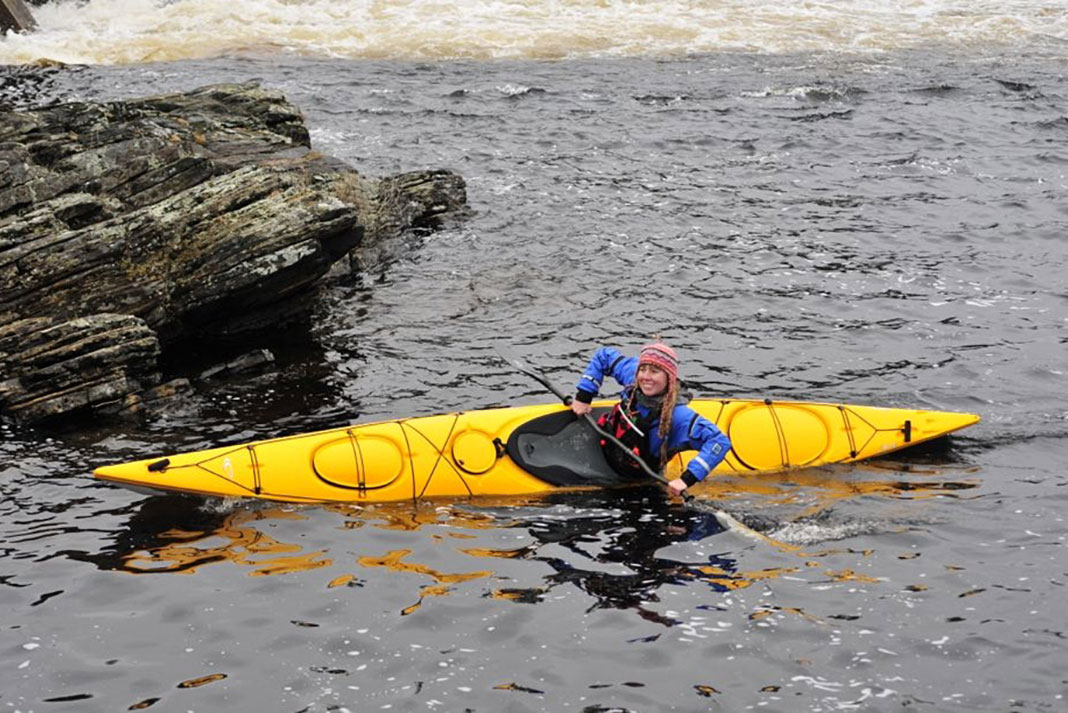 Woman paddles the Delta 15S kayak
