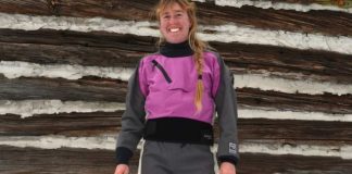 Woman wearing a purple and black drysuit