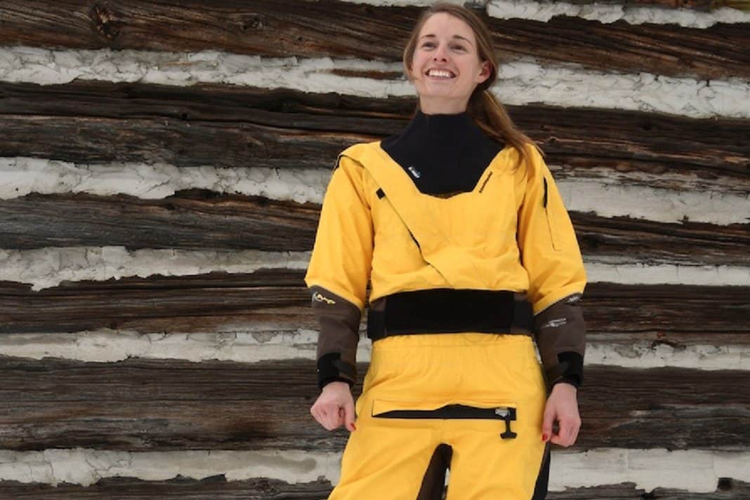 Woman wearing yellow and black drysuit