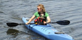 Woman paddling the Mercury GTX kayak from Point 65