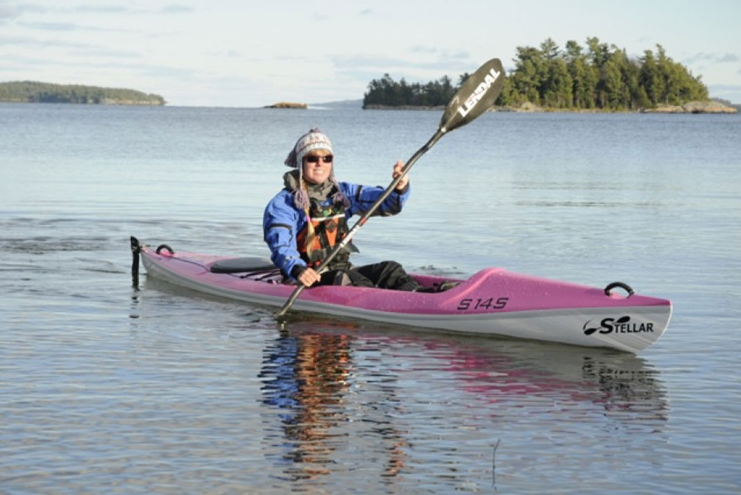 Woman paddling a Stellar S14S surfski