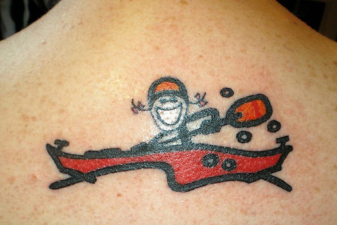 Cartoon girl paddling a kayak
