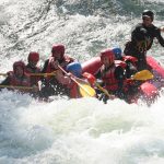 Top 5 Countries For River Guide Jobs This Winter A whitewater river rafting guide on the job, taking a group of paddlers downstream