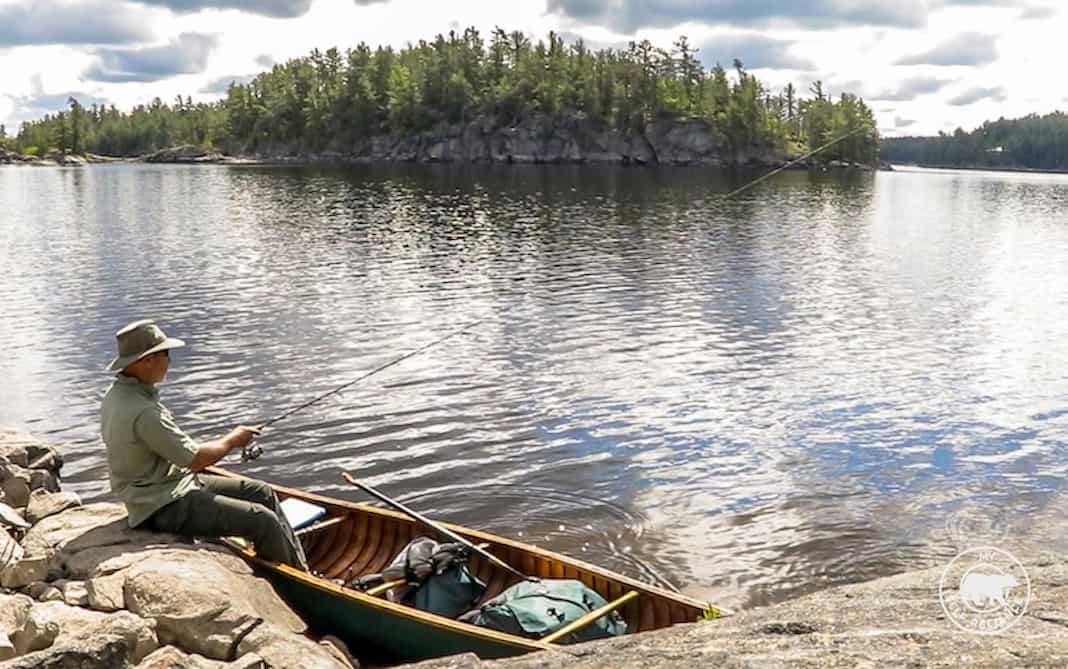 Shawn James fishes on the French River during a solo canoe trip. 