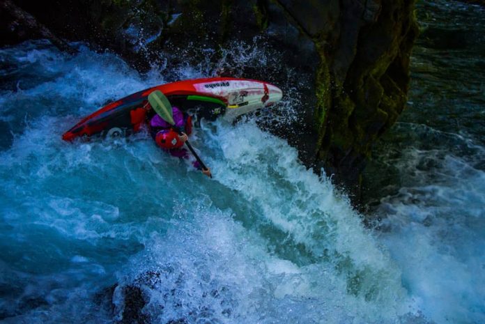 Person in whitewater kayak