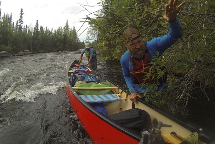 Frank Wolf testing an Esquif Canyon canoe in T-Formex