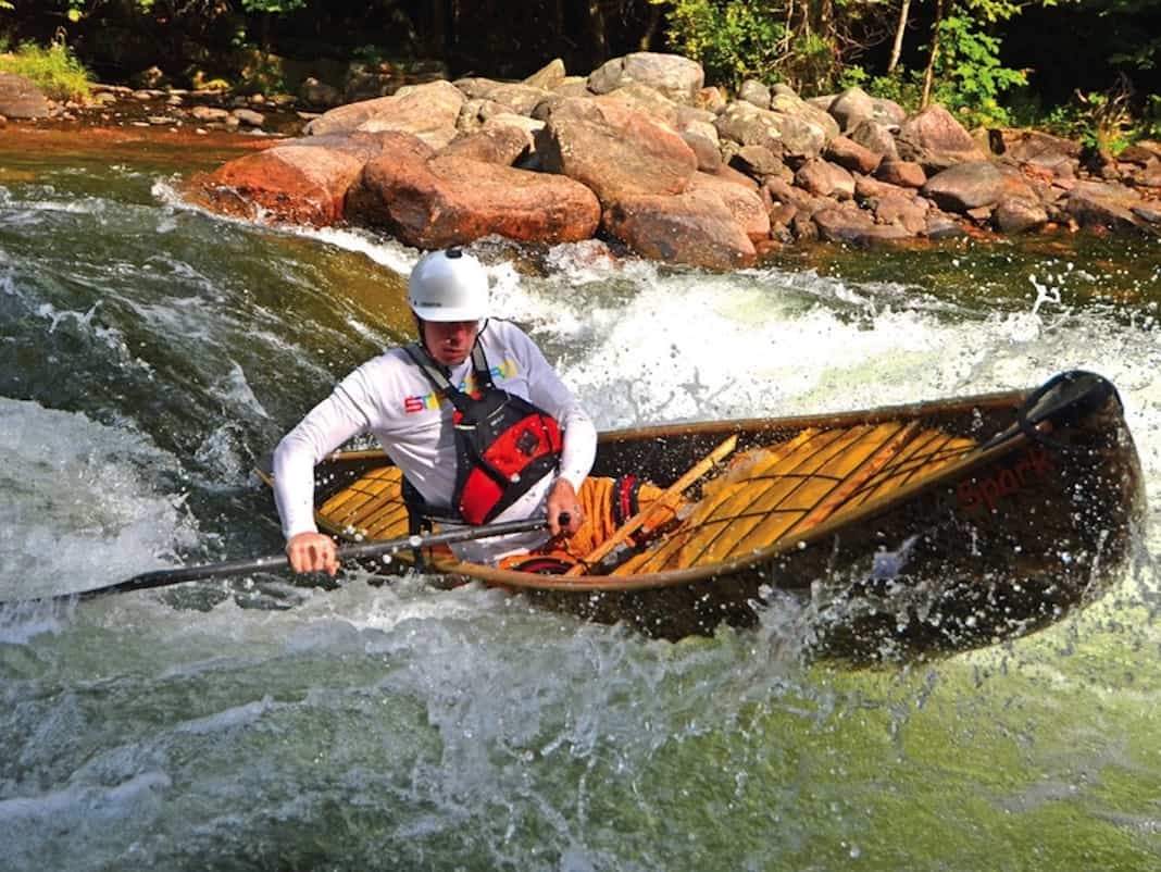 Man performing brace in canoe.