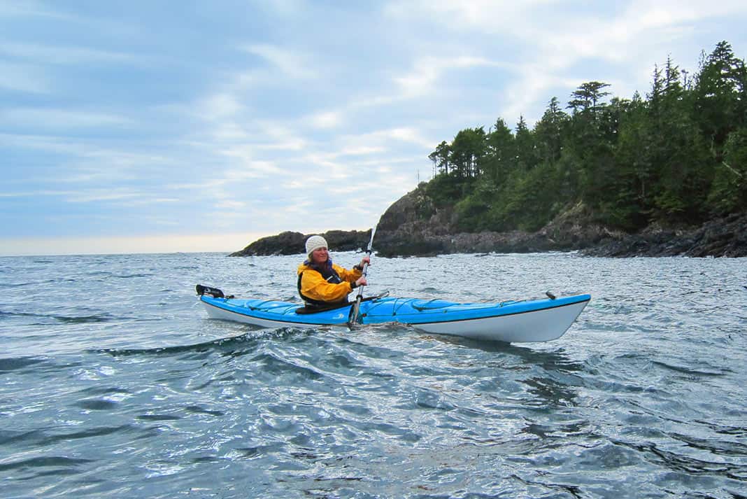Woman paddling a sea kayak