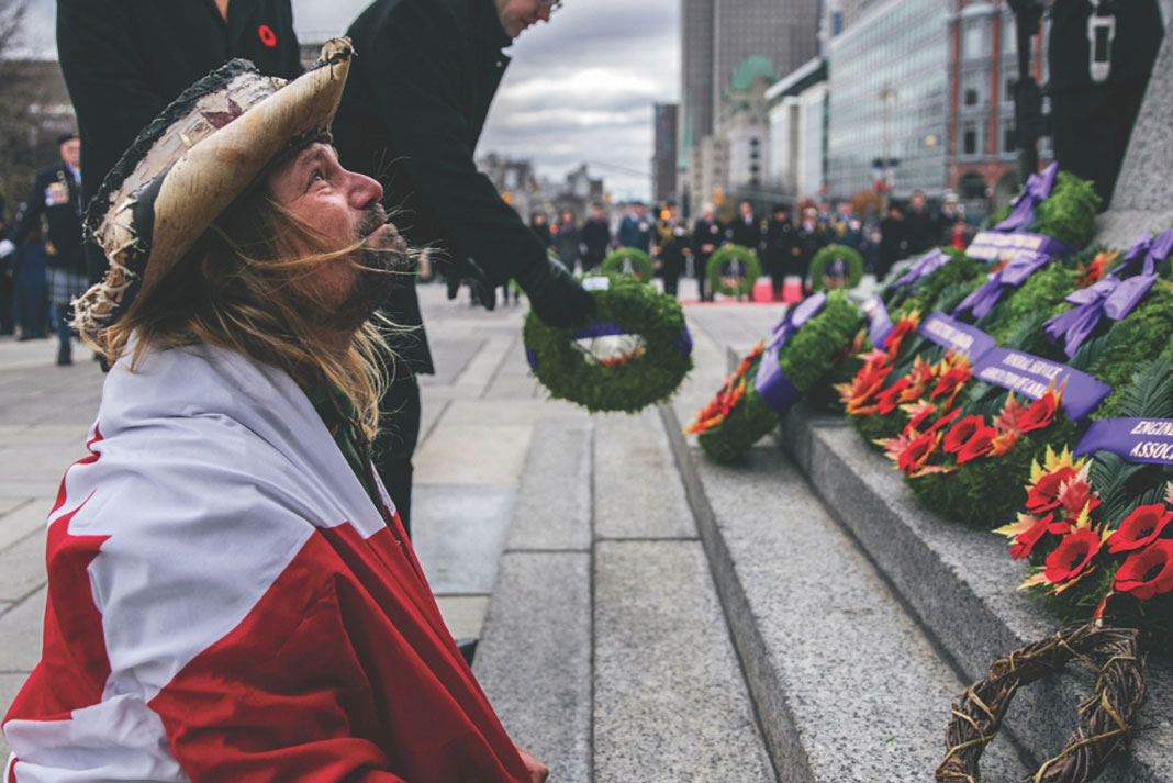 Mike Ranta places a wreath at the Tomb of the Unknown Soldier in Ottawa