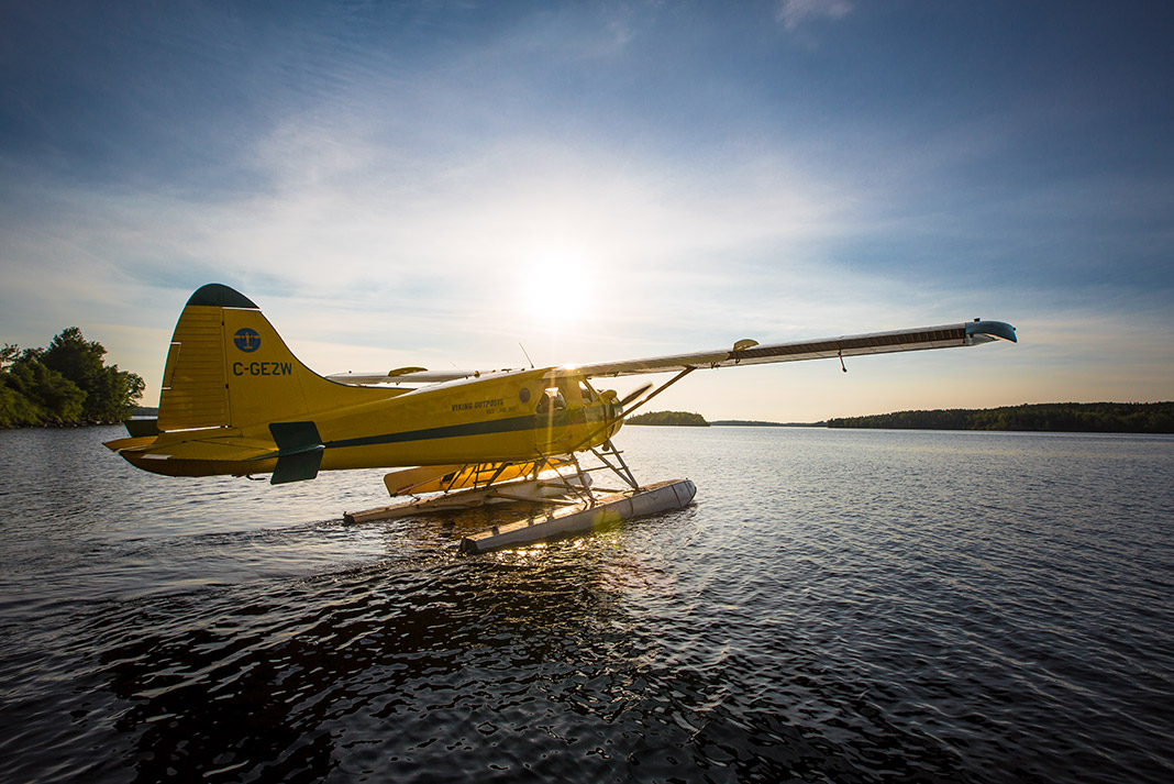 Yellow floatplane on the water