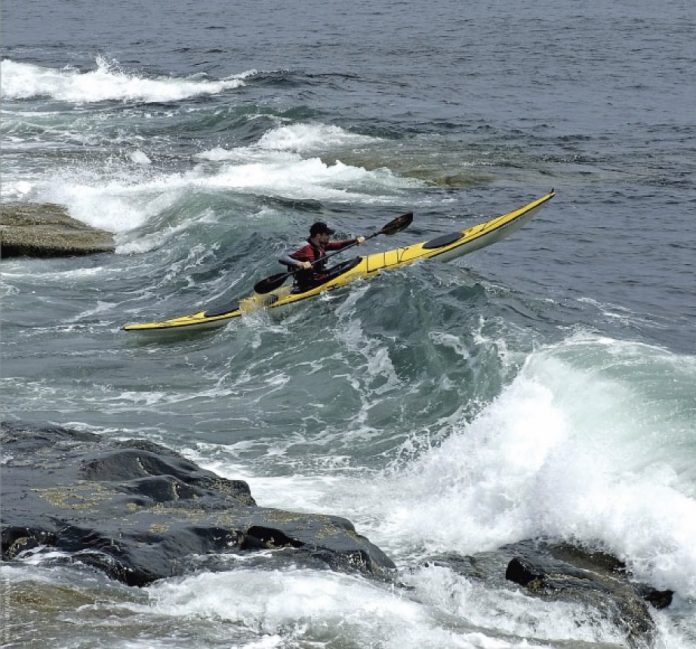 Kayaker in surf