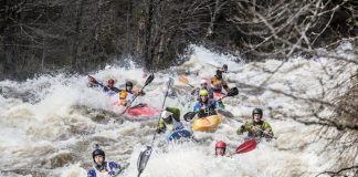 A group of kayak racers compete in the Neilson Race