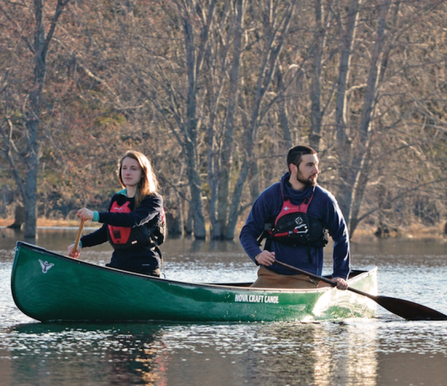 Woman and man canoeing