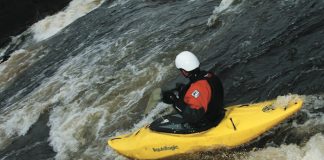 Kayaker paddling Liquidlogics' Lil' Joe kayak down whitewater