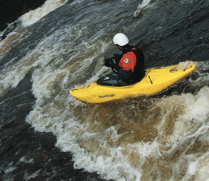 Kayaker paddling Liquidlogics' Lil' Joe kayak down whitewater