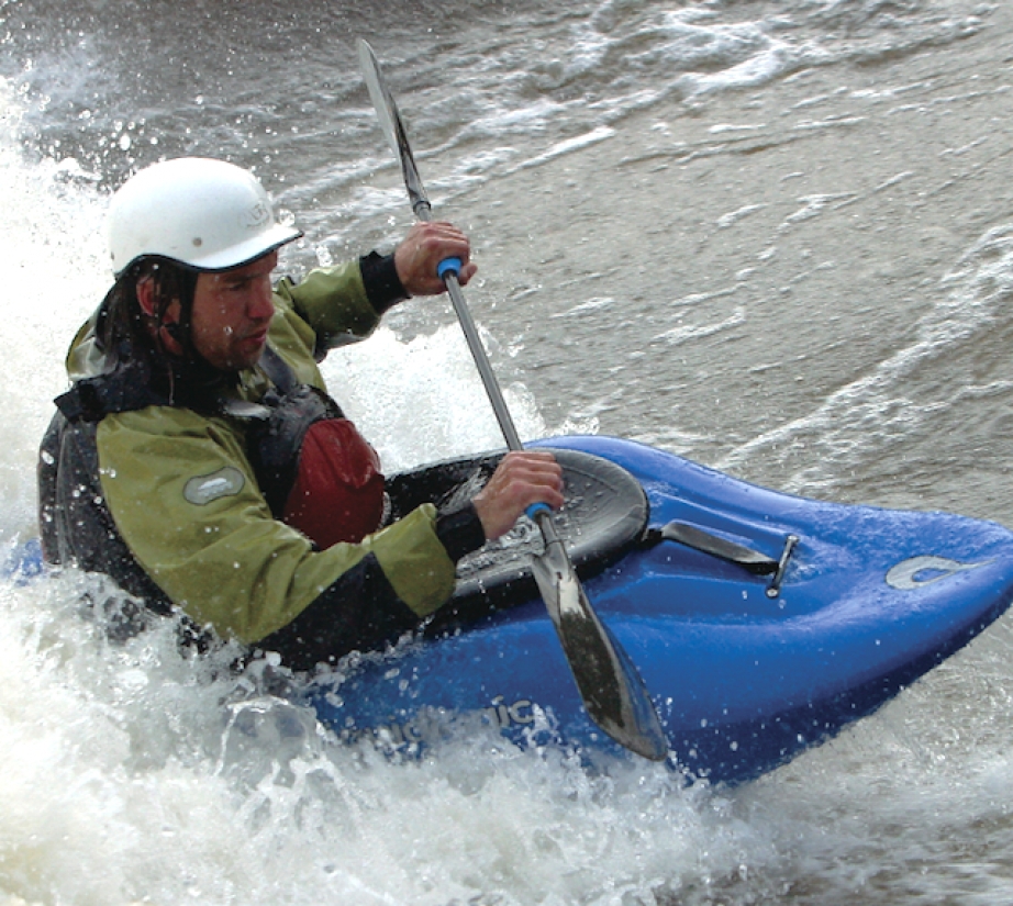 Man whitewater kayaking in a Liquidlogic Big Wheel kayak