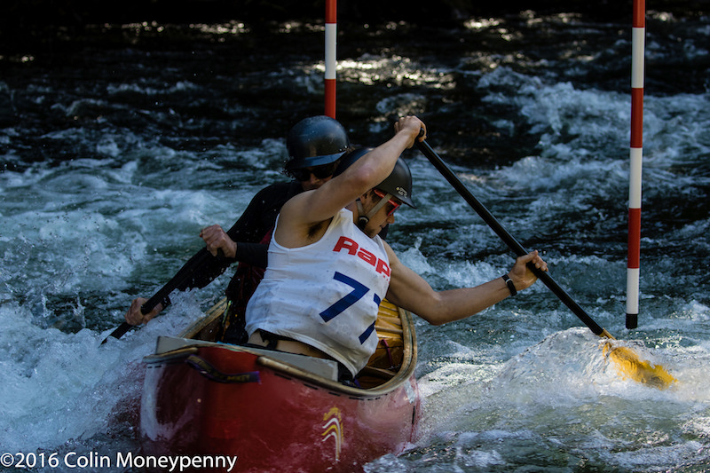 Two canoeists race on the Gull River