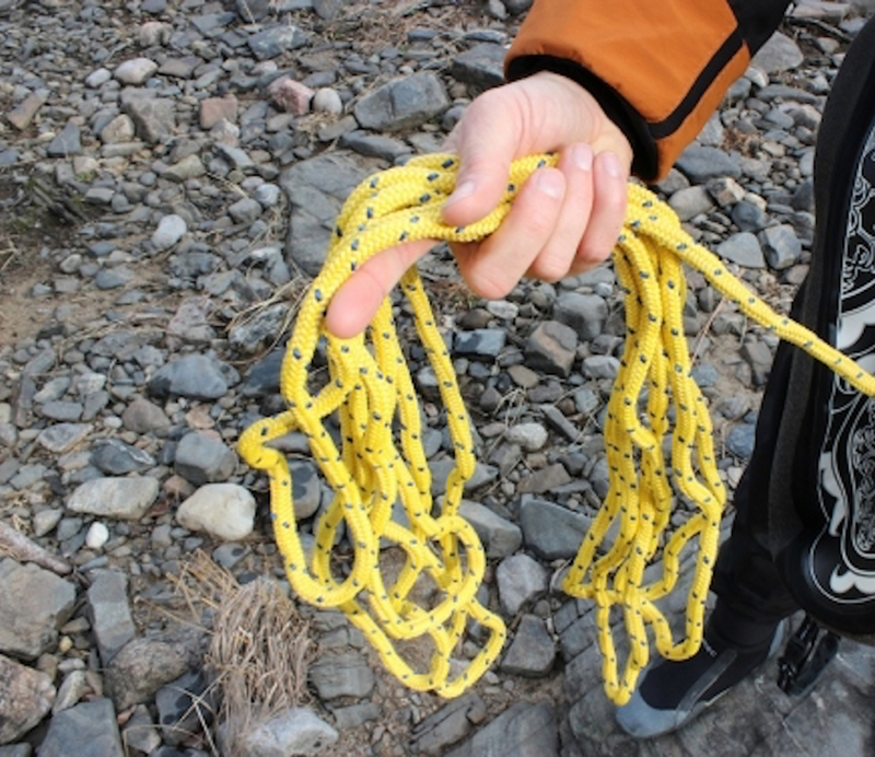 A yellow rope used for safety on the water.