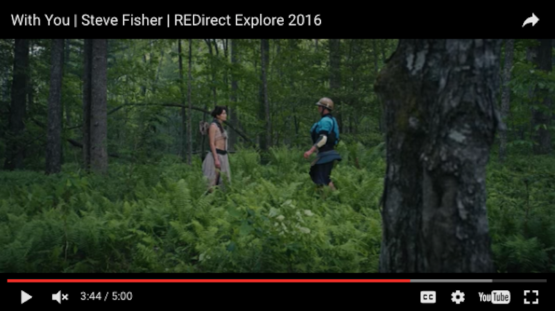 Whitewater kayaker Pat Keller stands in a field with a ferry in Steve Fisher's film "With You"