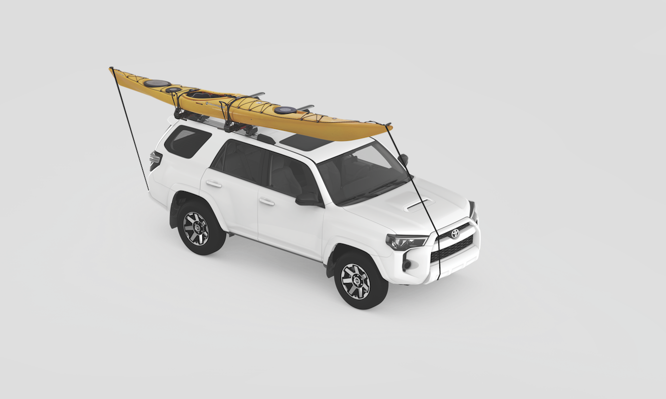 The Yakima ShowDown drop down roof rack with a kayak strapped to the roof.