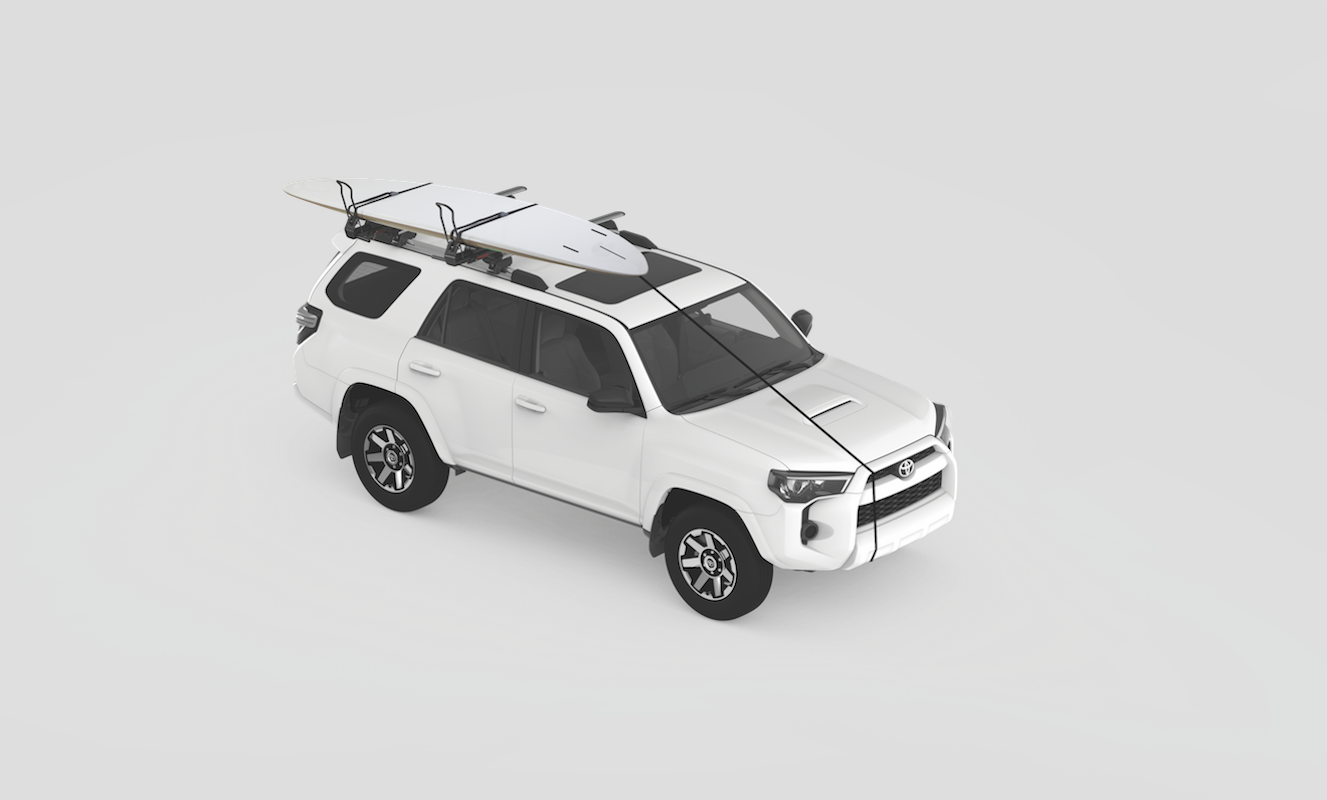 The Yakima ShowDown drop down roof rack with two standup paddleboards strapped to the roof.