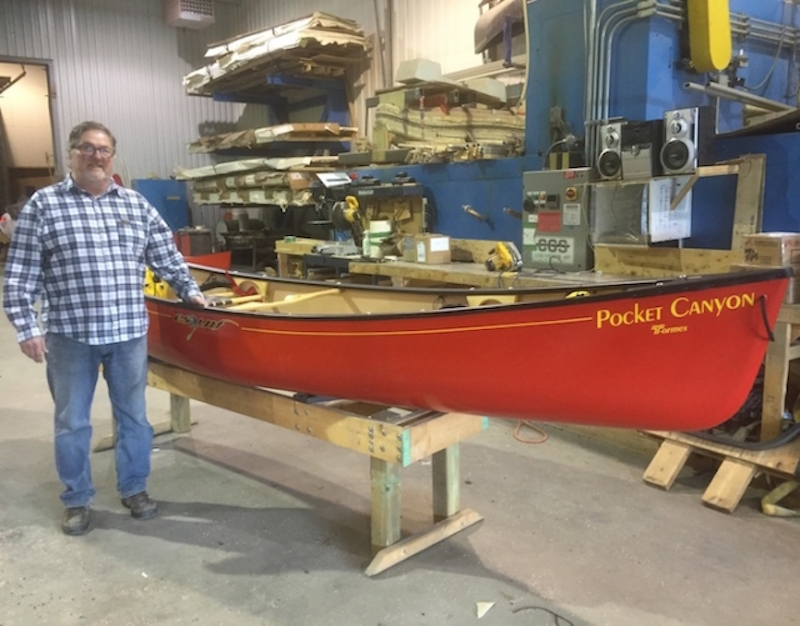 Jacques Chasse of Esquif stands in front of a canoe built using T-Formex. 