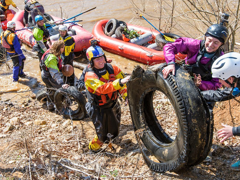 Paddlers wheel out garbage from the Nolichucky River.