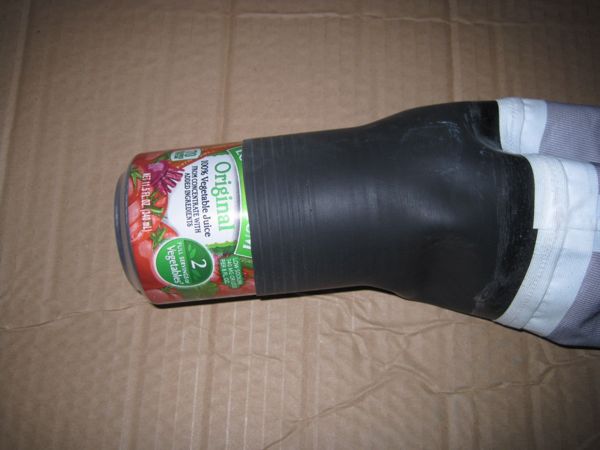 A can is placed in the wrist gasket of a drysuit to stretch it out