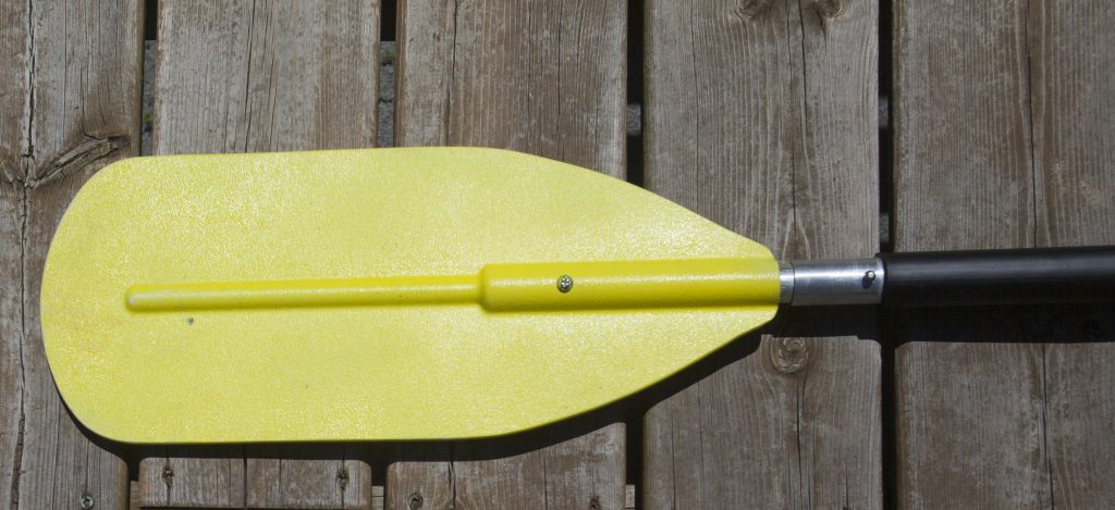 Ferrules on a yellow kayak paddle shaft