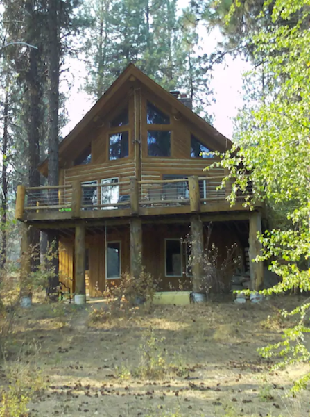 A log cabin Airbnb rental on the South Fork of the Payette River in Idaho. 