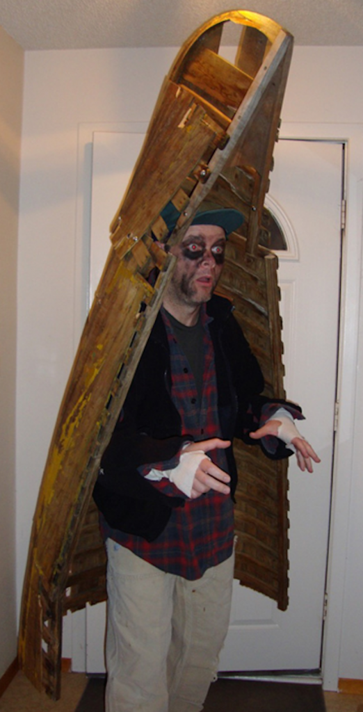 A boy in a canoe halloween costume