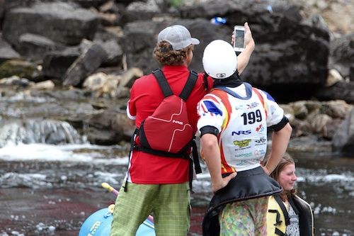 Anthony Hugo, the winner of the Junior Men's Finals, selfies on the shore of the Ottawa River at Garb during the ICF World Freestyle Kaak Championship.