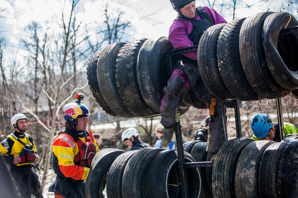Paddlers collect tires from the Nolichucky River.