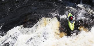 Person running a rapid in the Liquidlogic Mullet whitewater kayak