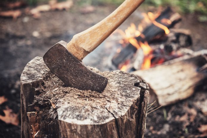 an axe in a log